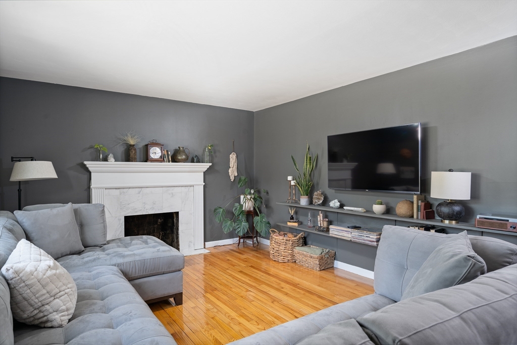 53 Mueller Road Holyoke, MA 01040 - Photo 11 of 40 a living room with furniture and a flat screen tv