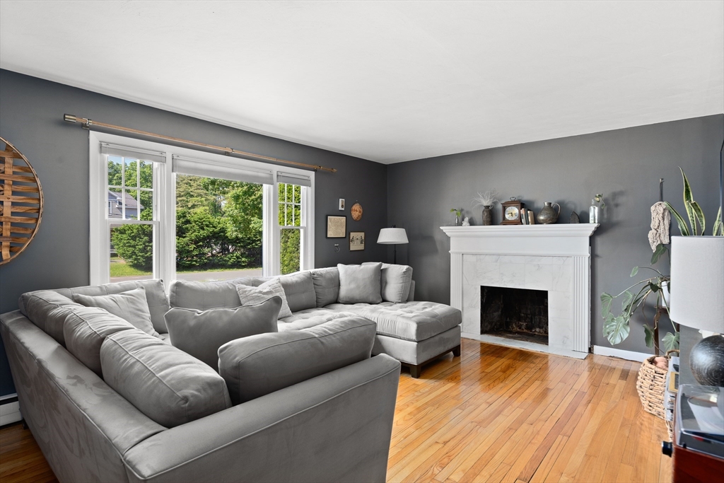 53 Mueller Road Holyoke, MA 01040 - Photo 13 of 40 a living room with furniture and a fireplace