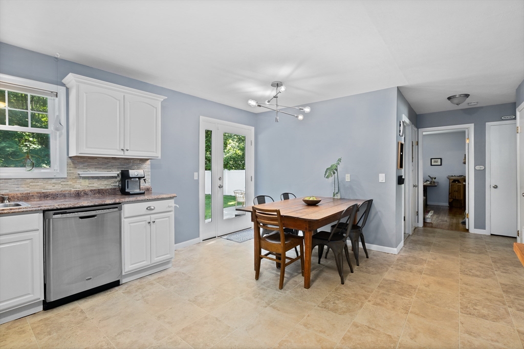 53 Mueller Road Holyoke, MA 01040 - Photo 20 of 40 a open kitchen with stainless steel appliances granite countertop a white table and chairs