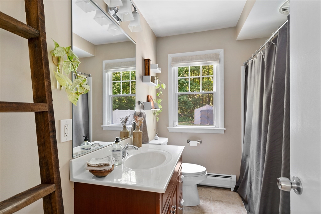 53 Mueller Road Holyoke, MA 01040 - Photo 28 of 40 a bathroom with a sink toilet and shower