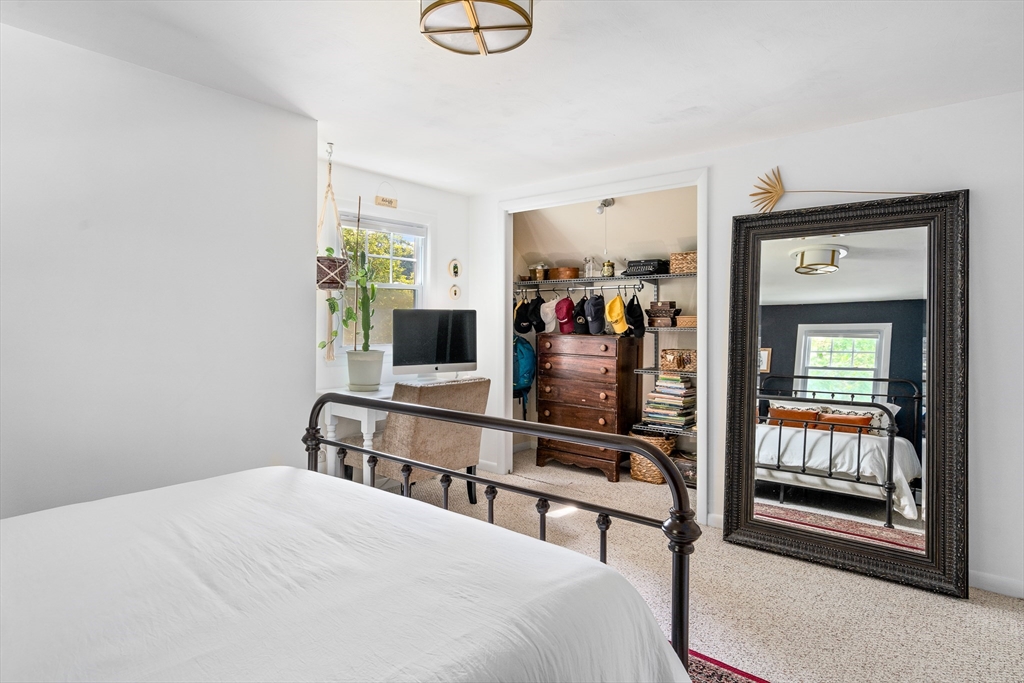 53 Mueller Road Holyoke, MA 01040 - Photo 33 of 40 a bedroom with a bed and a flat screen tv