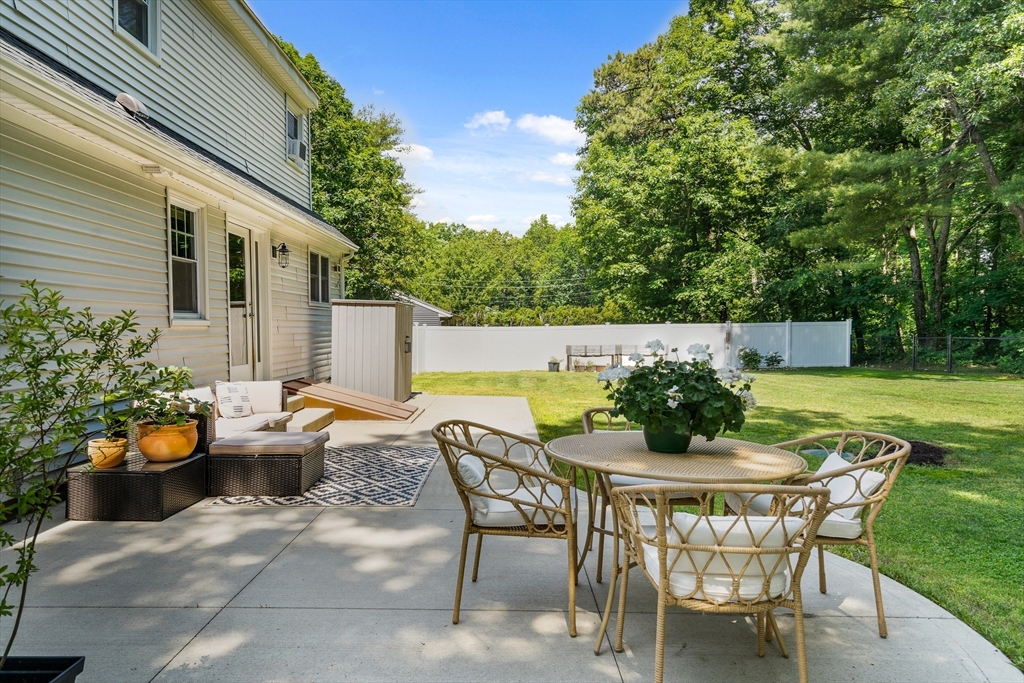 53 Mueller Road Holyoke, MA 01040 - Photo 6 of 40 a view of a patio with table and chairs and potted plants