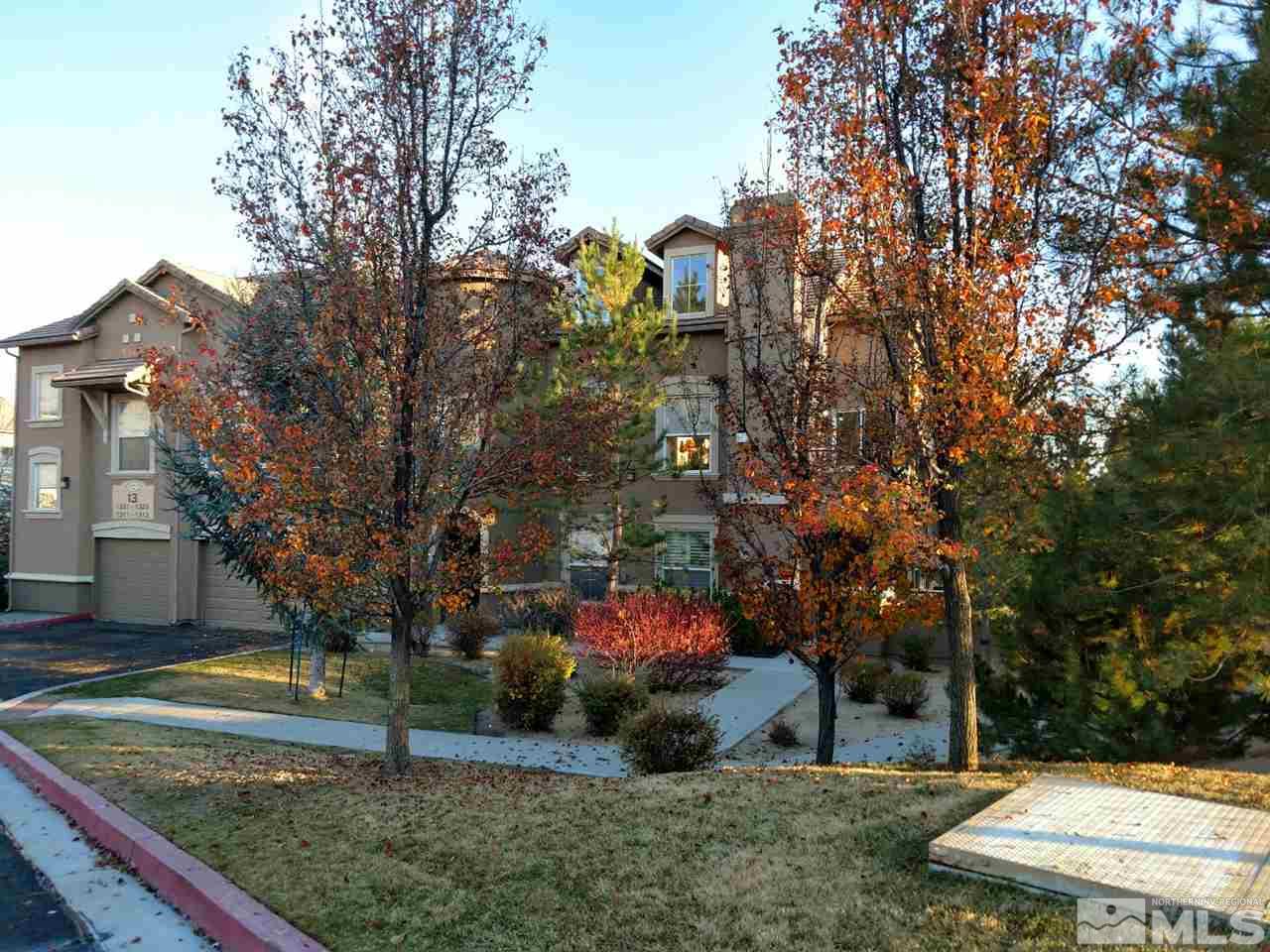 9050 Double R Boulevard, Unit 1325 Reno, NV 89521 - Photo 1 of 1 a backyard of a house with lots of green space