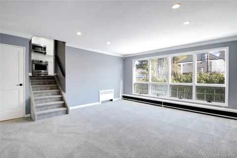 a view of an empty room with stairs