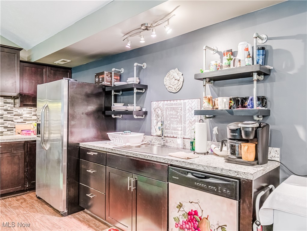 3267 Sandy Lake Road Ravenna, OH 44266 - Photo 10 of 22 Kitchen with sink, backsplash and stainless steel appliances