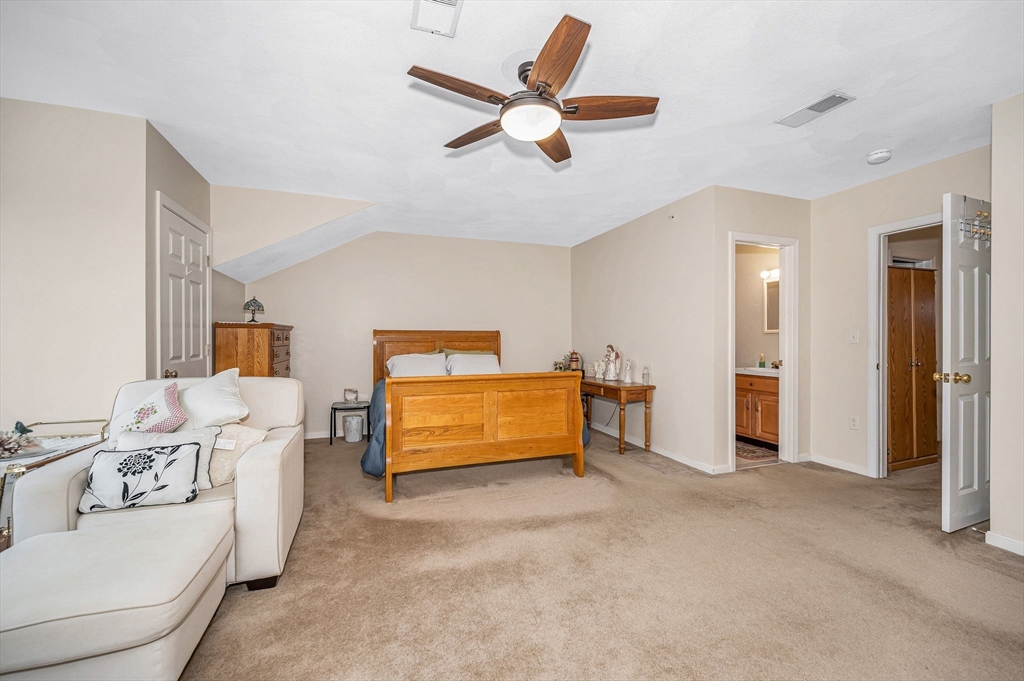 39 Broadway, Unit 305 Malden, MA 02148 - Photo 18 of 36 a living room with furniture and a ceiling fan