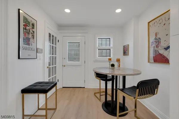 a view of a livingroom with furniture and a window