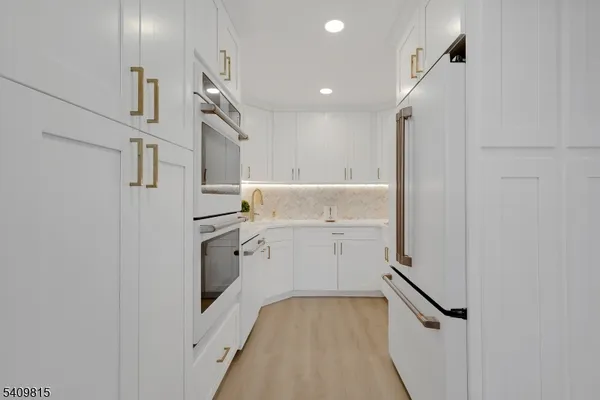 a view of hallway with washer and dryer