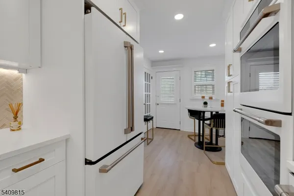 a view of entryway with wooden floor and stairs