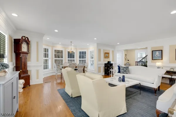 a living room with fireplace furniture and a wooden floor