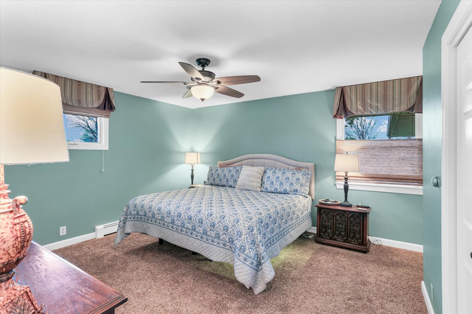 106 Cherry Drive Fithian, IL 61844 - Photo 24 of 39 a bedroom with a bed and a chandelier