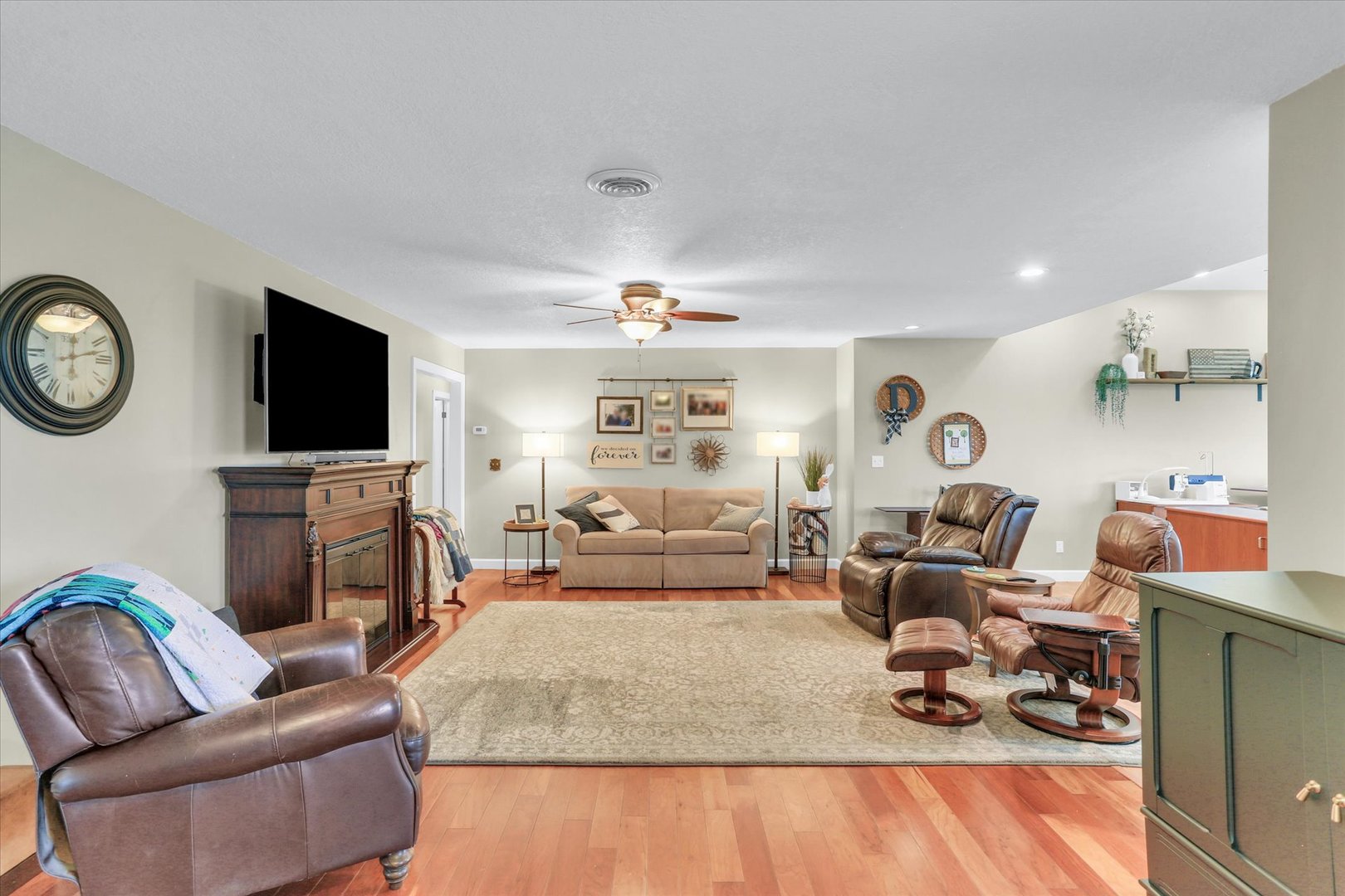 106 Cherry Drive Fithian, IL 61844 - Photo 8 of 39 a living room with furniture a flat screen tv and a fireplace
