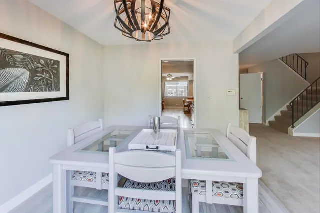 a kitchen with stainless steel appliances granite countertop sink stove top oven and cabinets