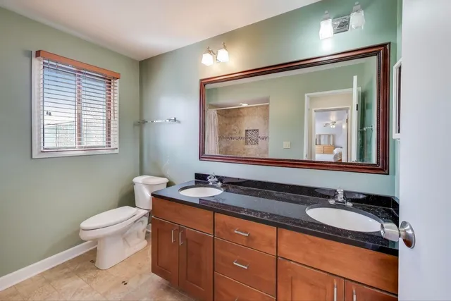 a bedroom with a bed and a cabinets