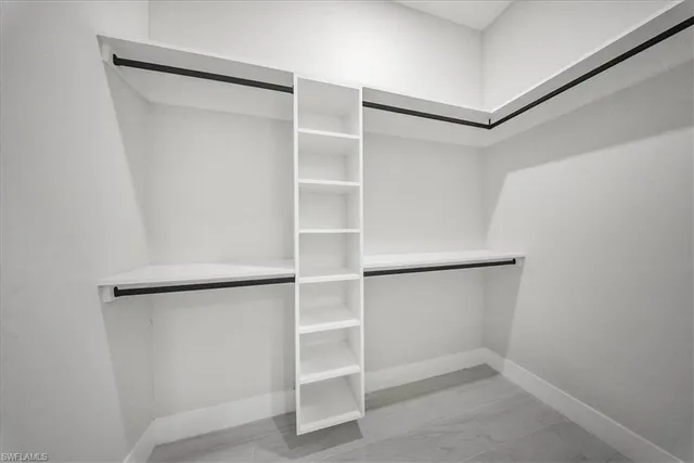 a view of an empty walk in closet