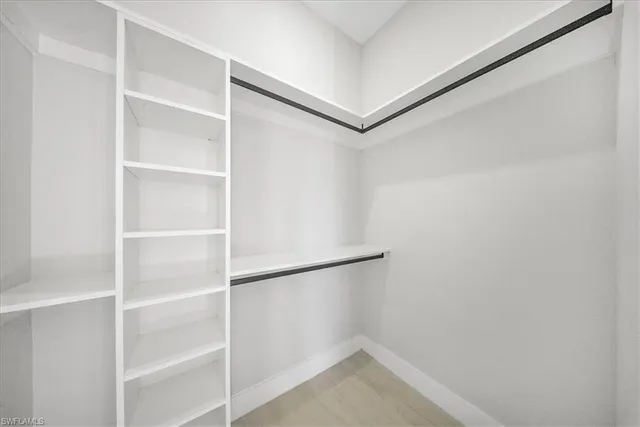 a view of an empty walk in closet