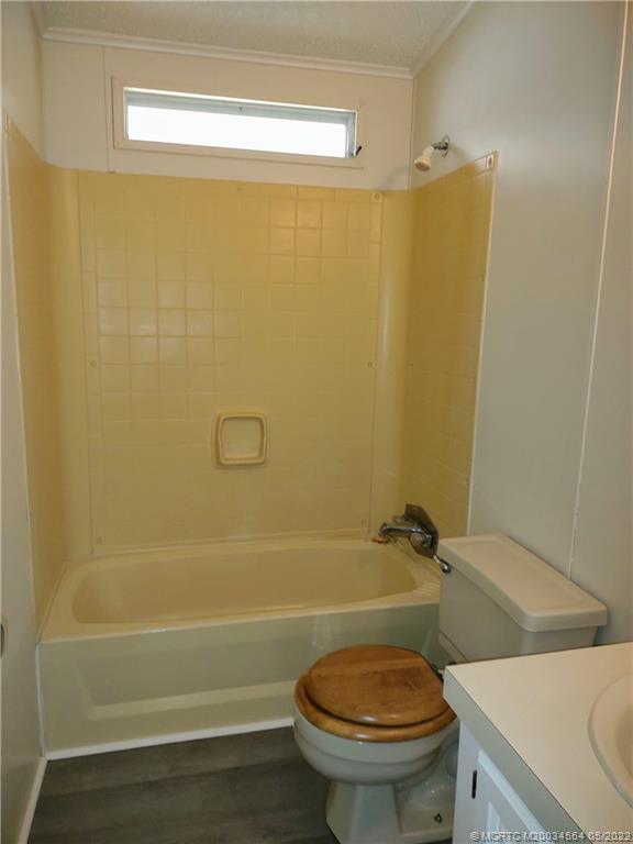 524 Thames Bluff Ridge, Unit D18 Fort Pierce, FL 34982 - Photo 18 of 24 a bathroom with a sink a toilet and shower