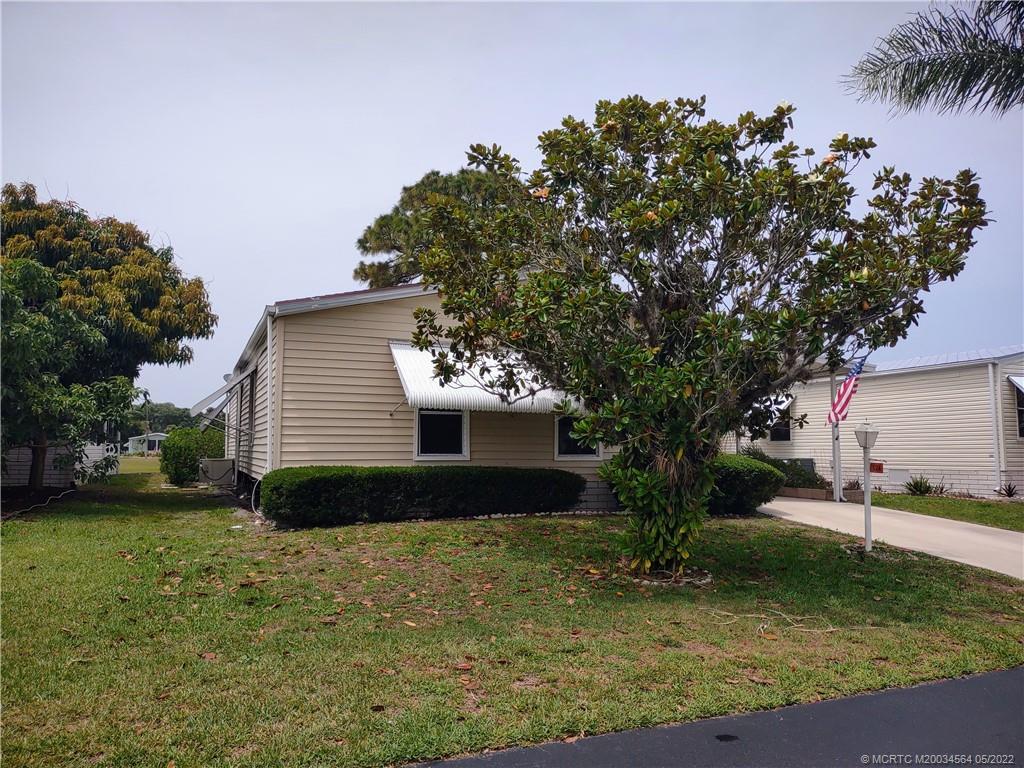 524 Thames Bluff Ridge, Unit D18 Fort Pierce, FL 34982 - Photo 2 of 24 a front view of a house with garden