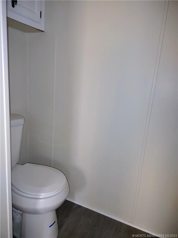 524 Thames Bluff Ridge, Unit D18 Fort Pierce, FL 34982 - Photo 21 of 24 a white toilet sitting next to a white sink