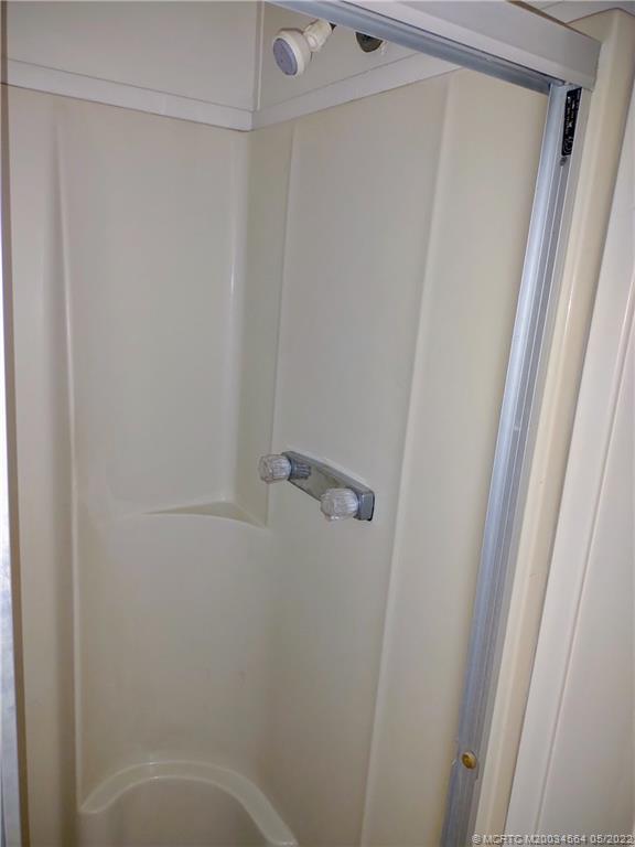 524 Thames Bluff Ridge, Unit D18 Fort Pierce, FL 34982 - Photo 22 of 24 a bathroom with a shower