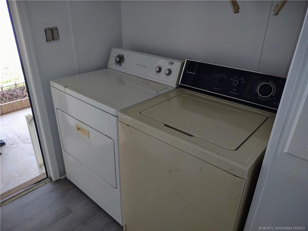 524 Thames Bluff Ridge, Unit D18 Fort Pierce, FL 34982 - Photo 8 of 24 a utility room with dryer and washer