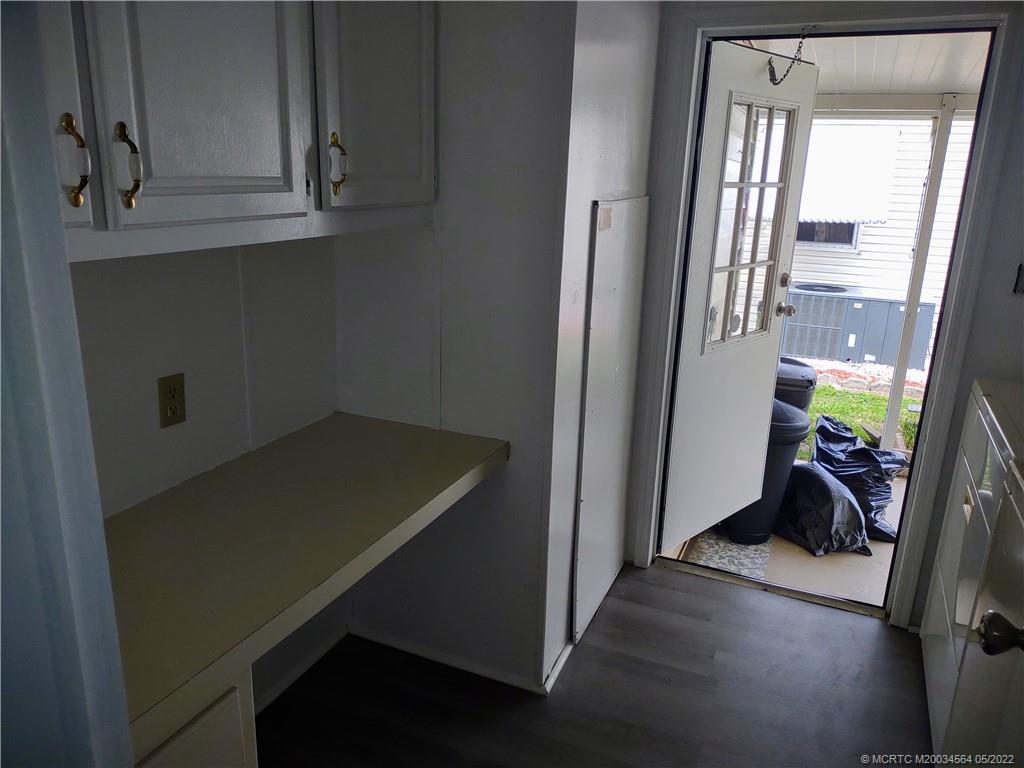 524 Thames Bluff Ridge, Unit D18 Fort Pierce, FL 34982 - Photo 9 of 24 a view of a room with wooden floor and windows