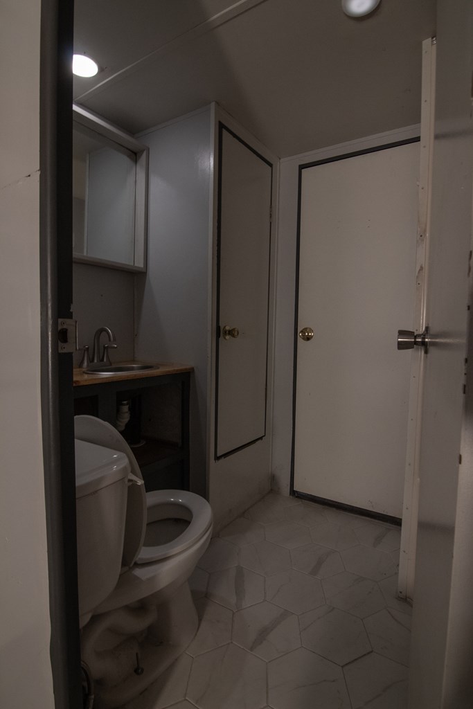 71 6th Street Ellijay, GA 30540 - Photo 5 of 9 a bathroom with a toilet and a shower