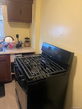 a close up of a stove top oven sitting inside of a kitchen