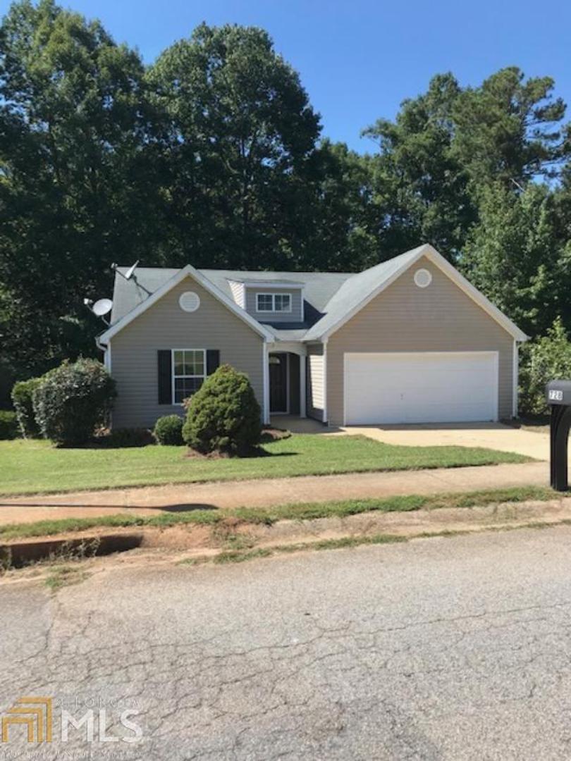 728 Crystal Bay Road Villa Rica, GA 30180 - Photo 1 of 1 a front view of a house with a garden