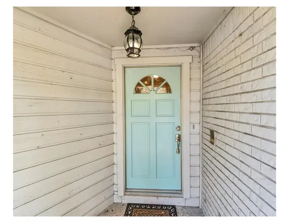 a view of a door and a window