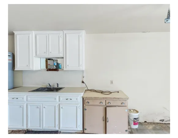 a view of a kitchen with cabinets