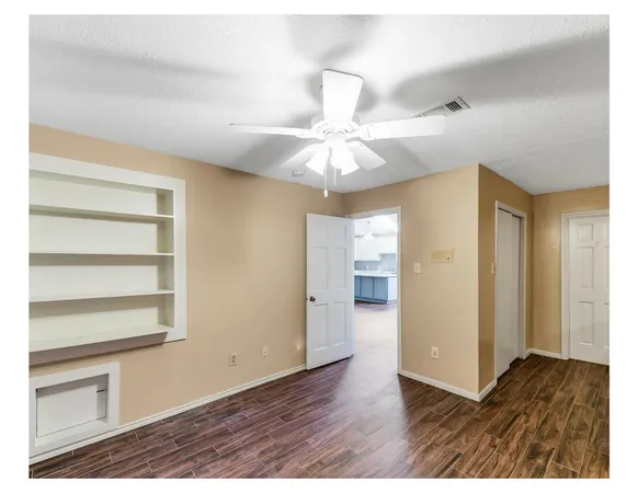 a view of a livingroom with wooden floor