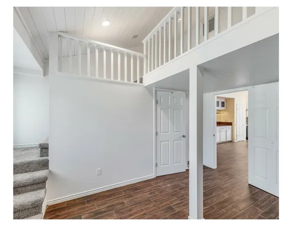 a view of entryway with wooden floor