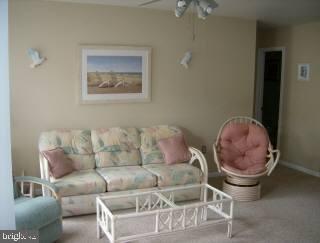 0 Edward Taylor Road, Unit 129 Ocean City, MD 21842 - Photo 4 of 6 a living room with furniture and a painting