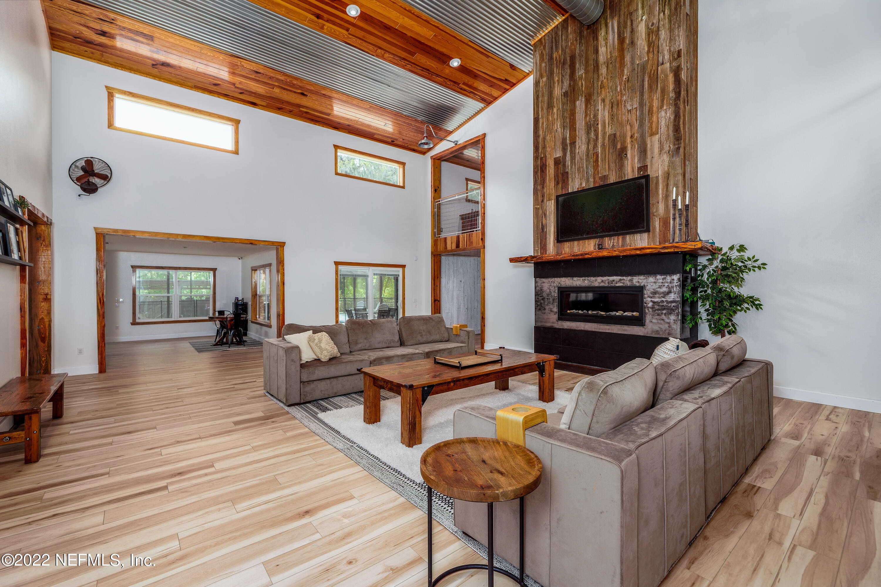 541 Federal Point Road East Palatka, FL 32131 - Photo 11 of 75 a living room with fireplace furniture and a flat screen tv