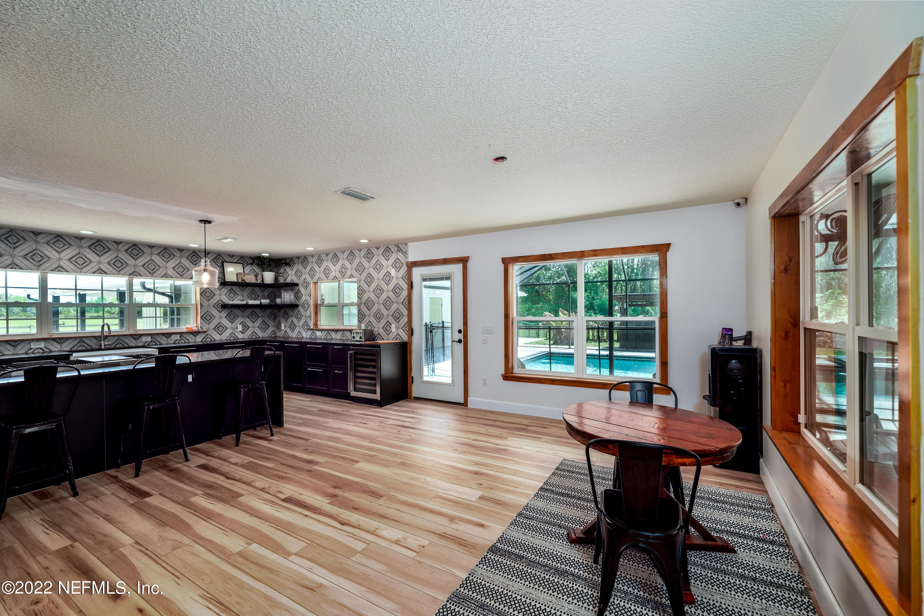 541 Federal Point Road East Palatka, FL 32131 - Photo 13 of 75 a kitchen with a wooden table and chairs