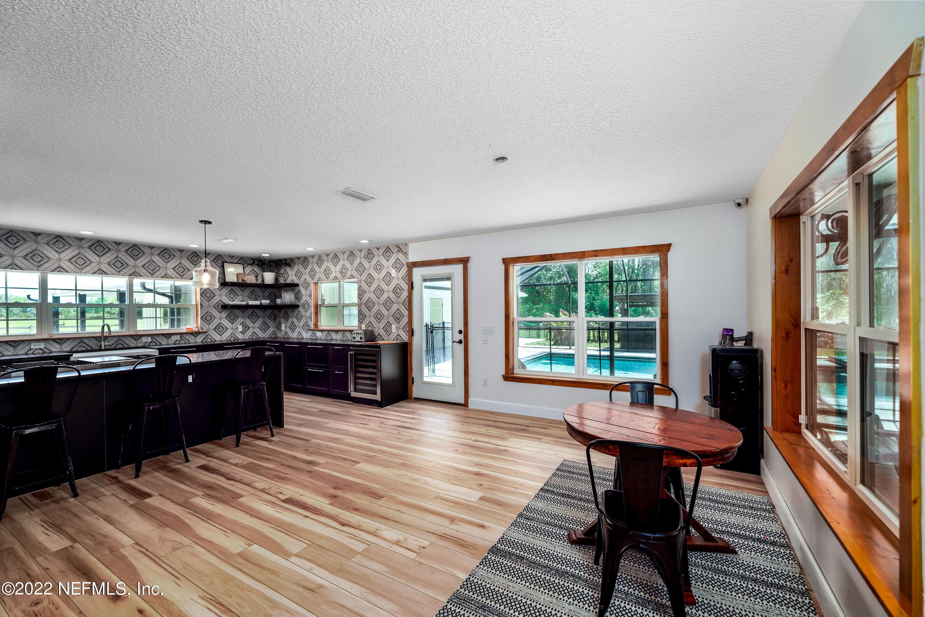 541 Federal Point Road East Palatka, FL 32131 - Photo 15 of 75 a kitchen with a wooden table and chairs