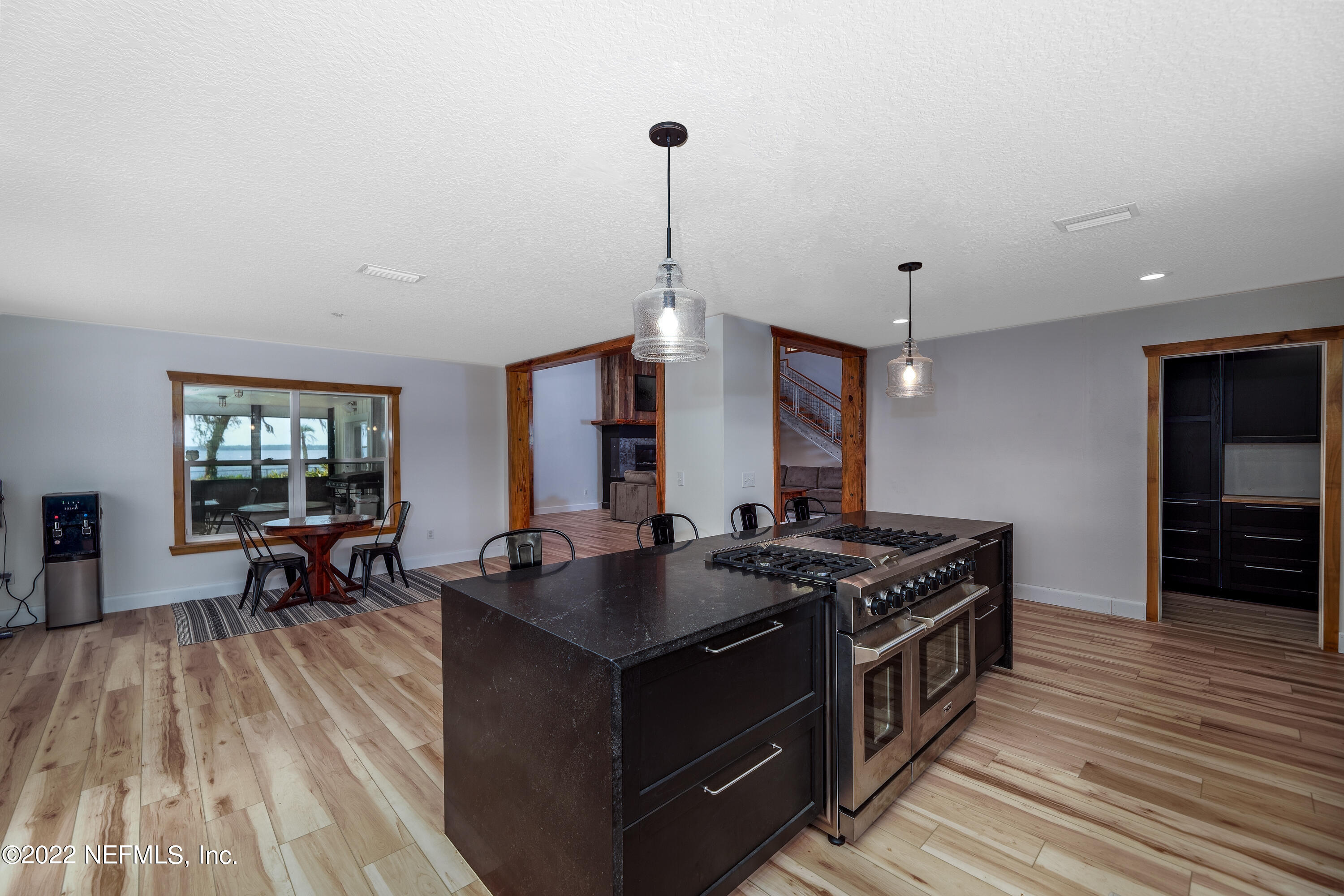 541 Federal Point Road East Palatka, FL 32131 - Photo 18 of 75 a kitchen with stainless steel appliances granite countertop a stove and a wooden floors