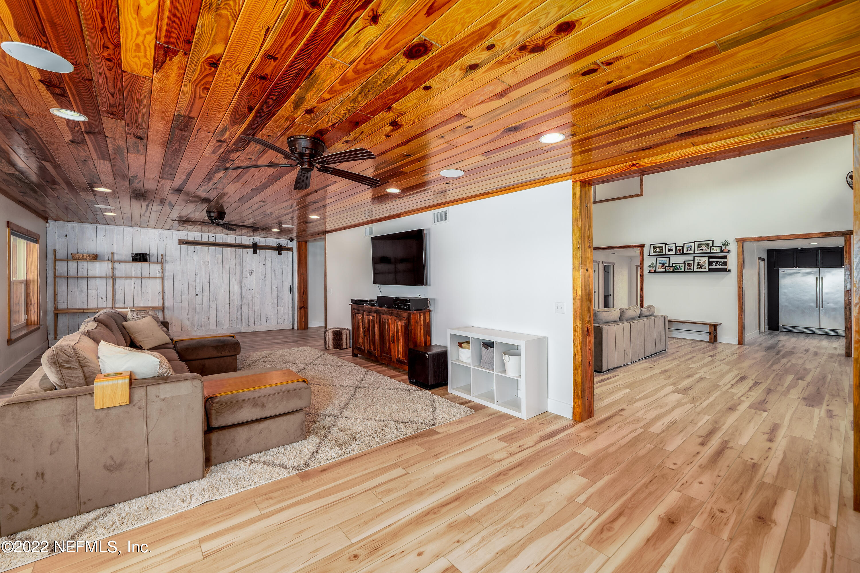 541 Federal Point Road East Palatka, FL 32131 - Photo 19 of 75 a living room with furniture and a flat screen tv