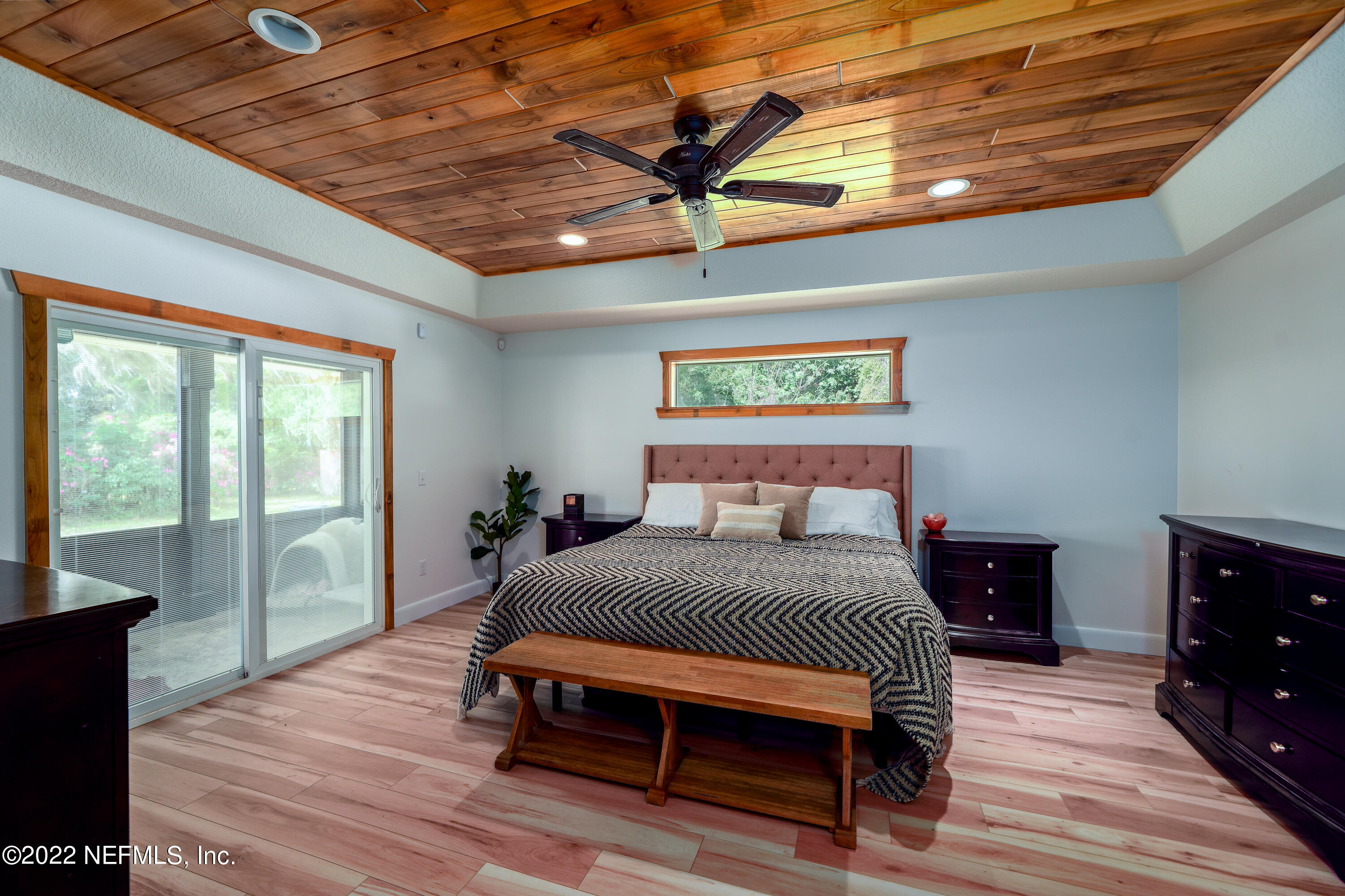 541 Federal Point Road East Palatka, FL 32131 - Photo 22 of 75 a bedroom with a bed and wooden floor