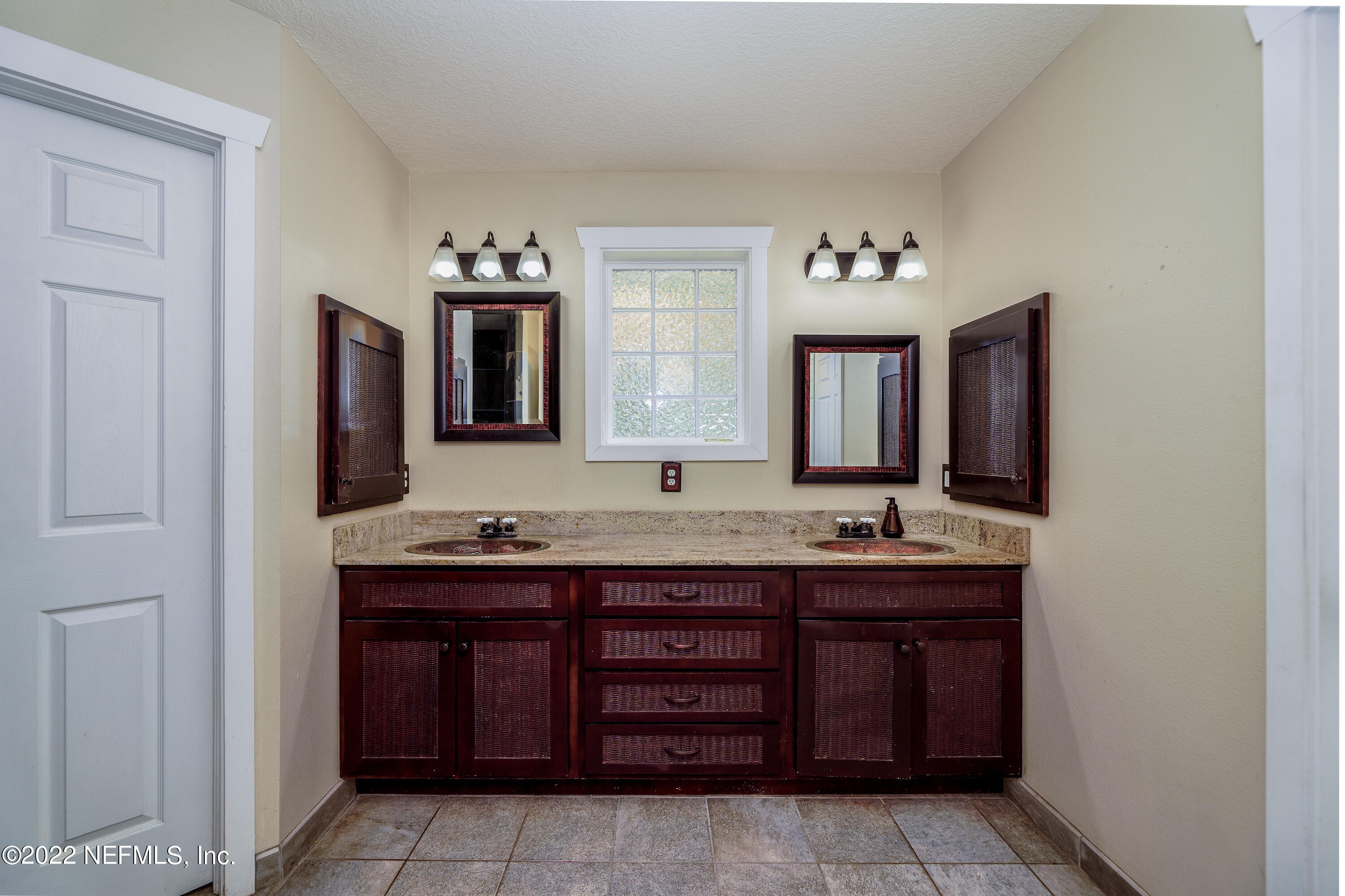 541 Federal Point Road East Palatka, FL 32131 - Photo 25 of 75 a bathroom with a granite countertop double vanity sink and a mirror