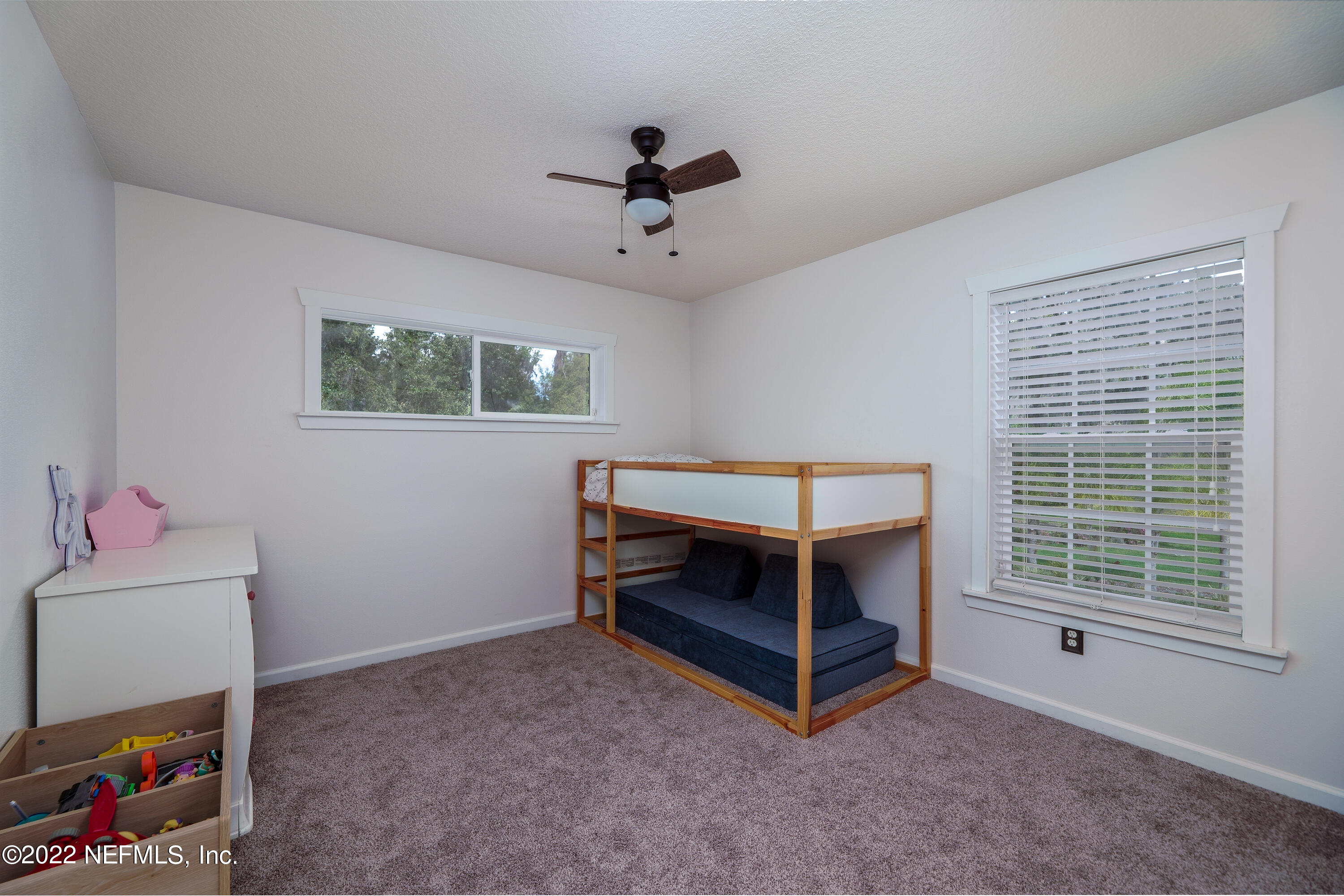 541 Federal Point Road East Palatka, FL 32131 - Photo 27 of 75 a bedroom with furniture and a window