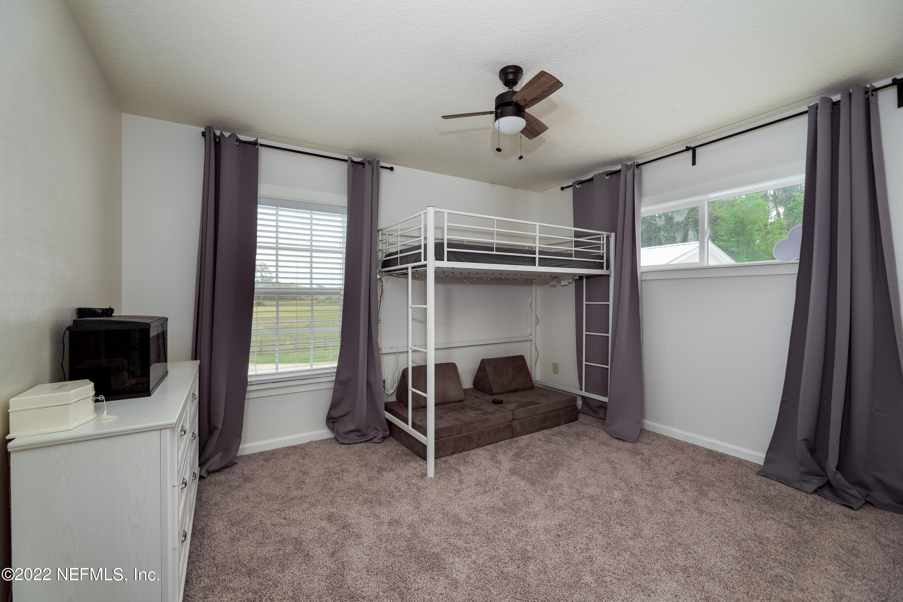 541 Federal Point Road East Palatka, FL 32131 - Photo 29 of 75 a living room with furniture and a flat screen tv