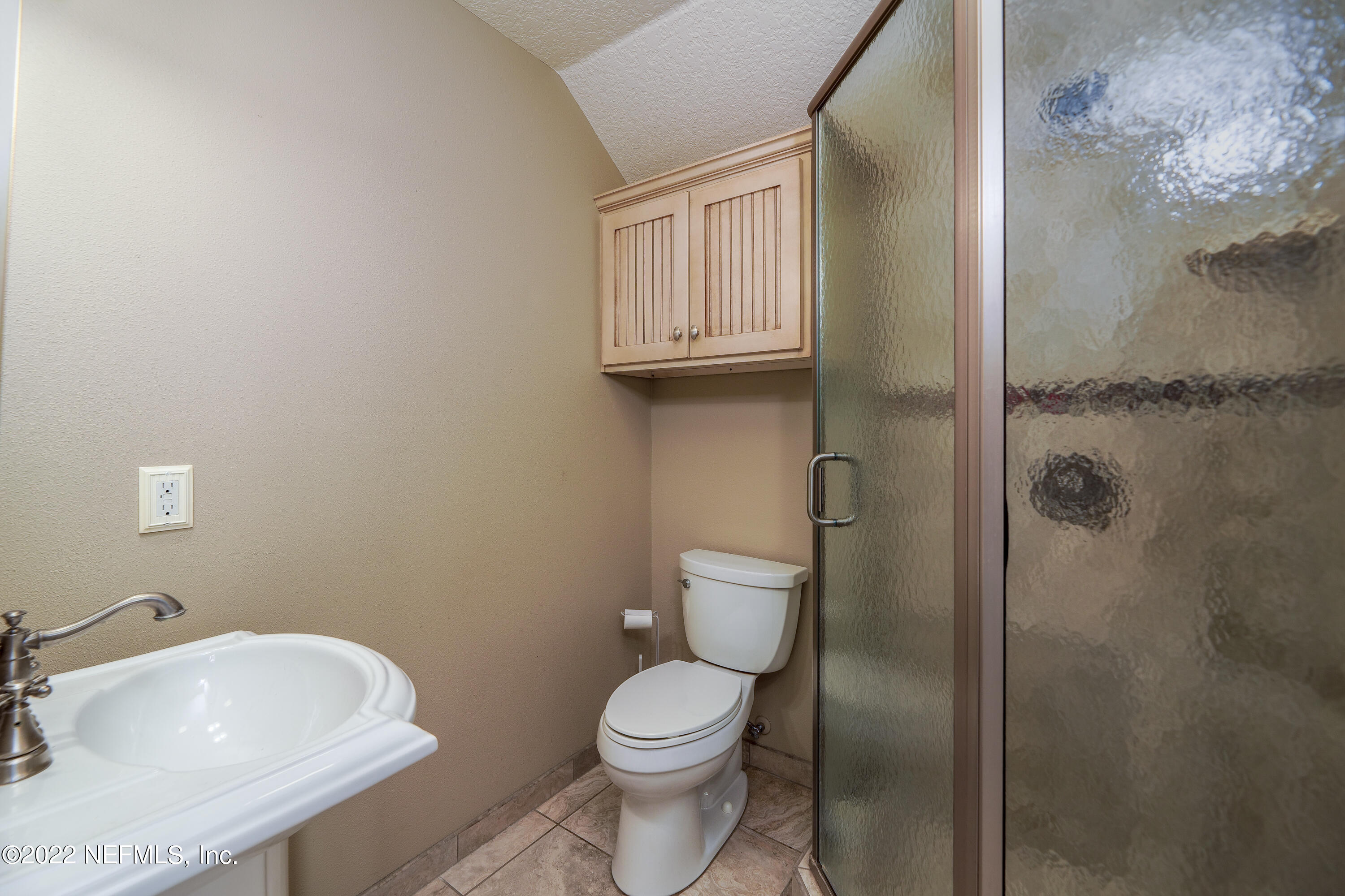 541 Federal Point Road East Palatka, FL 32131 - Photo 31 of 75 a white toilet sitting next to a bathroom sink