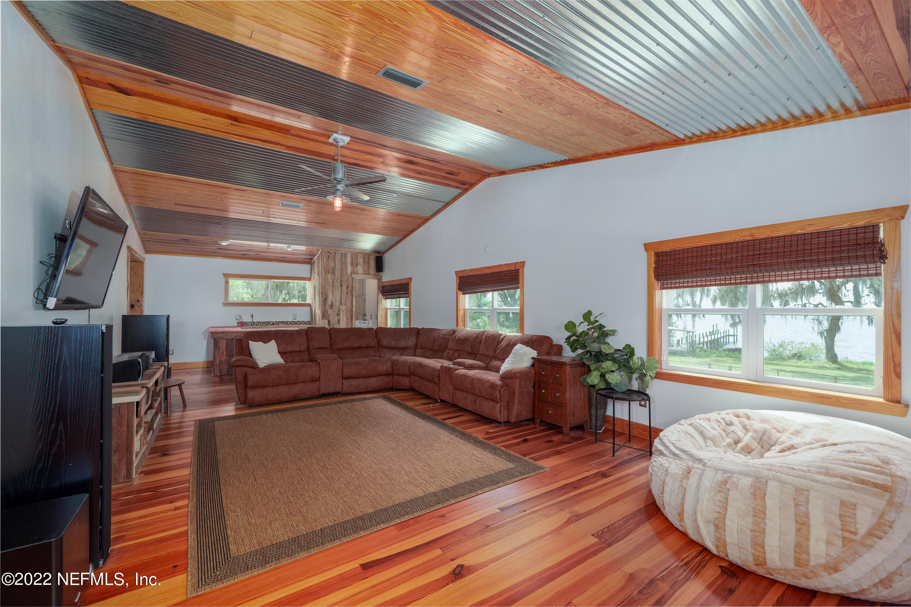541 Federal Point Road East Palatka, FL 32131 - Photo 33 of 75 a living room with furniture and a large window
