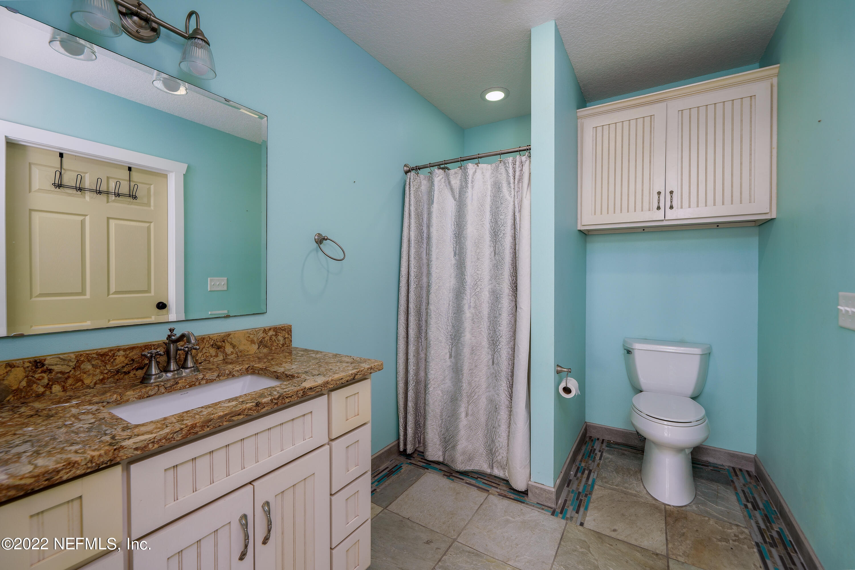 541 Federal Point Road East Palatka, FL 32131 - Photo 37 of 75 a bathroom with a granite countertop sink toilet and shower