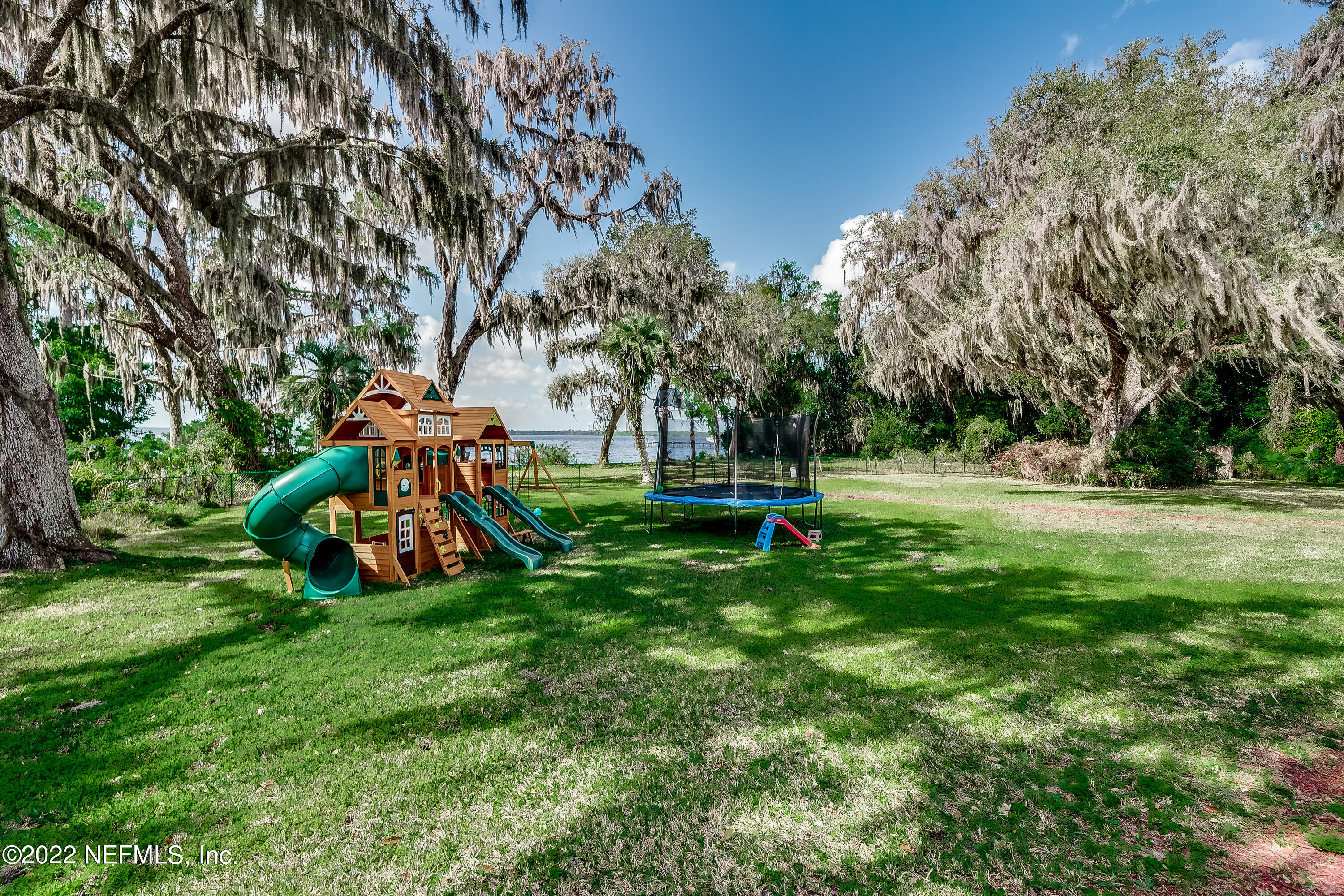 541 Federal Point Road East Palatka, FL 32131 - Photo 43 of 75 a view of a park with swings and slides