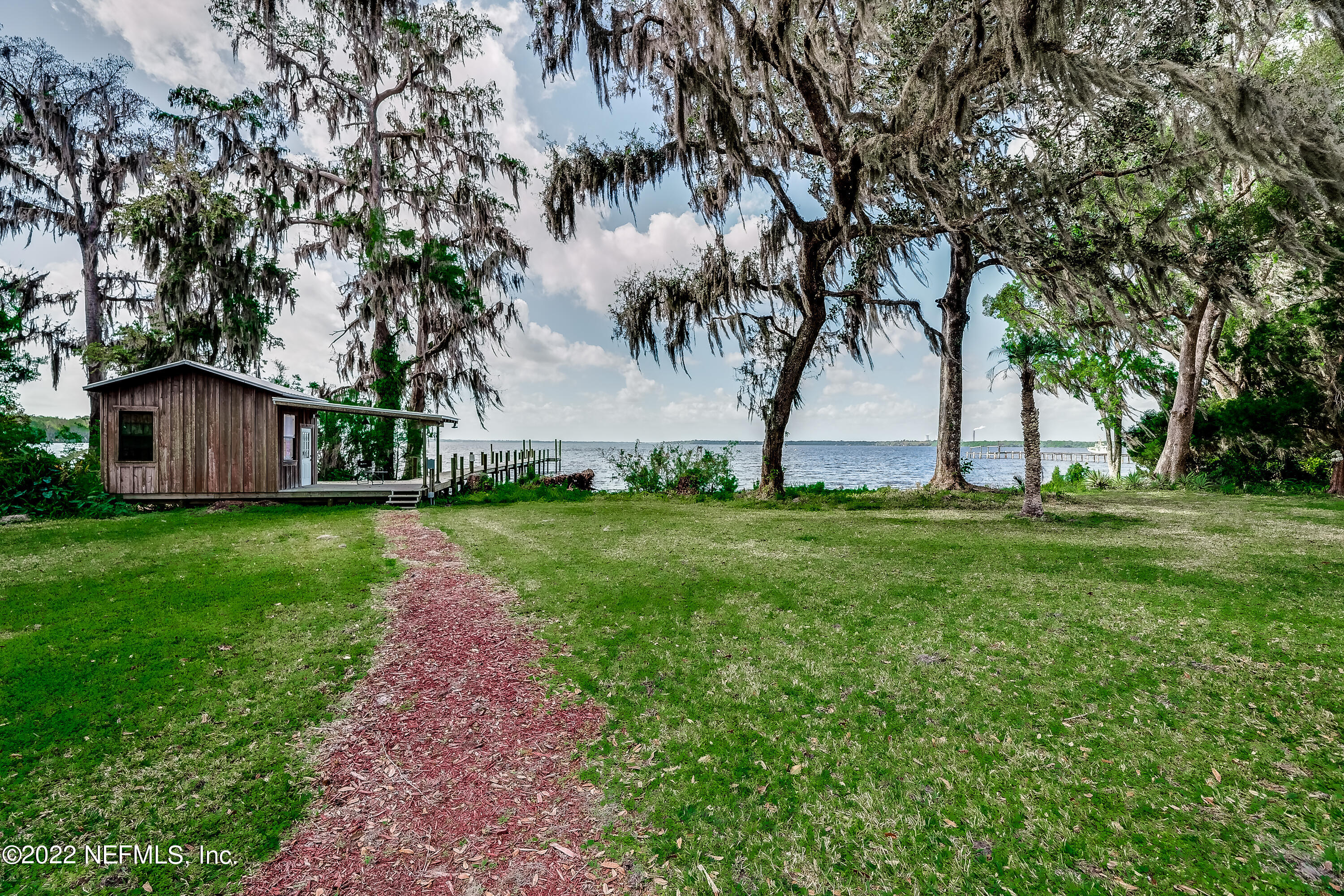 541 Federal Point Road East Palatka, FL 32131 - Photo 45 of 75 a view of a backyard with large trees