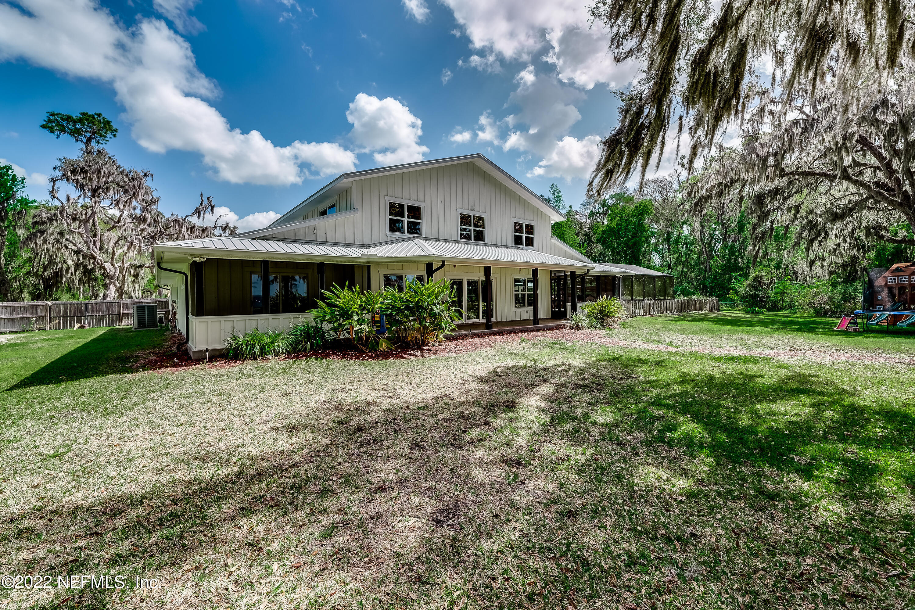 541 Federal Point Road East Palatka, FL 32131 - Photo 51 of 75 a house with green field in front of it