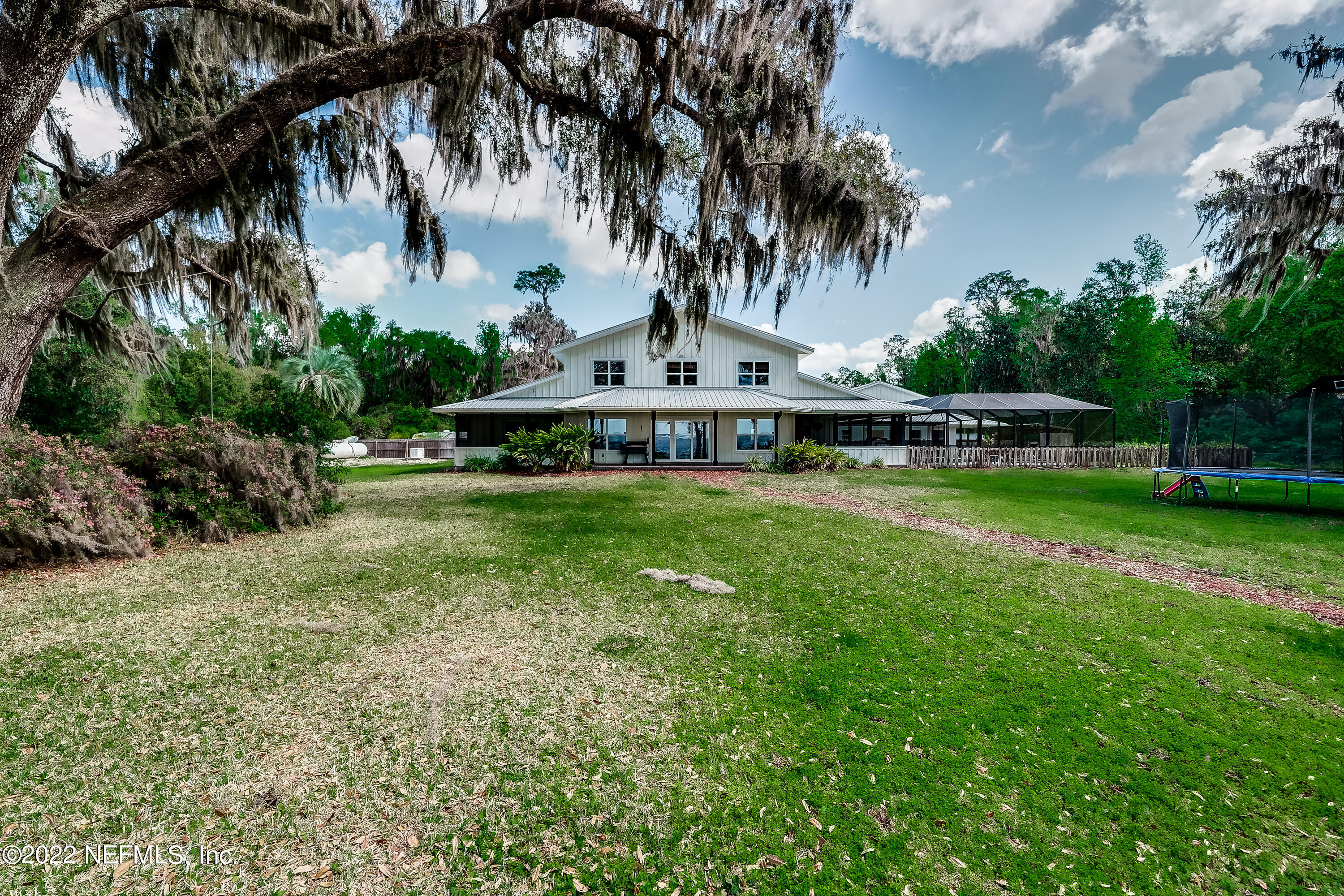 541 Federal Point Road East Palatka, FL 32131 - Photo 52 of 75 a view of a swimming pool with a garden